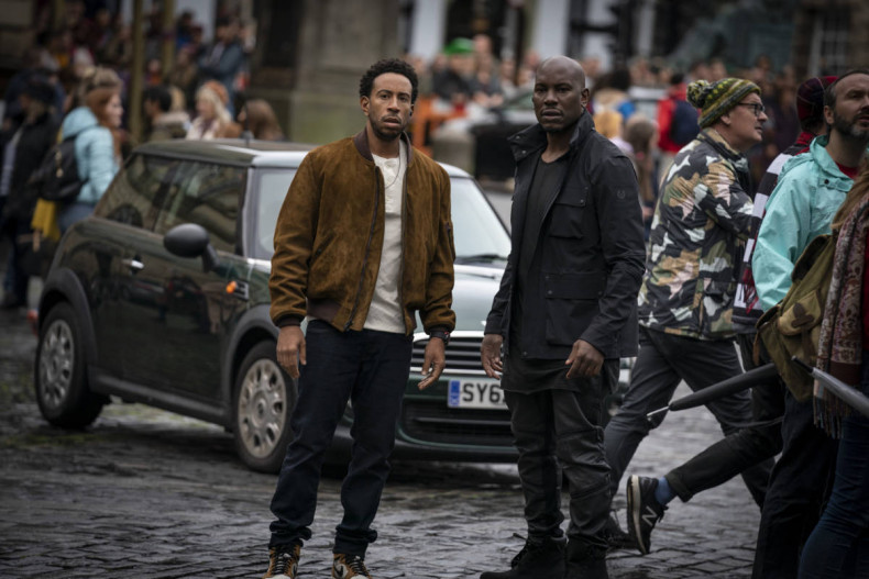 (from left, centered) Tej (Chris “Ludacris” Bridges) and Roman (Tyrese Gibson) in F9, directed by Justin Lin.
