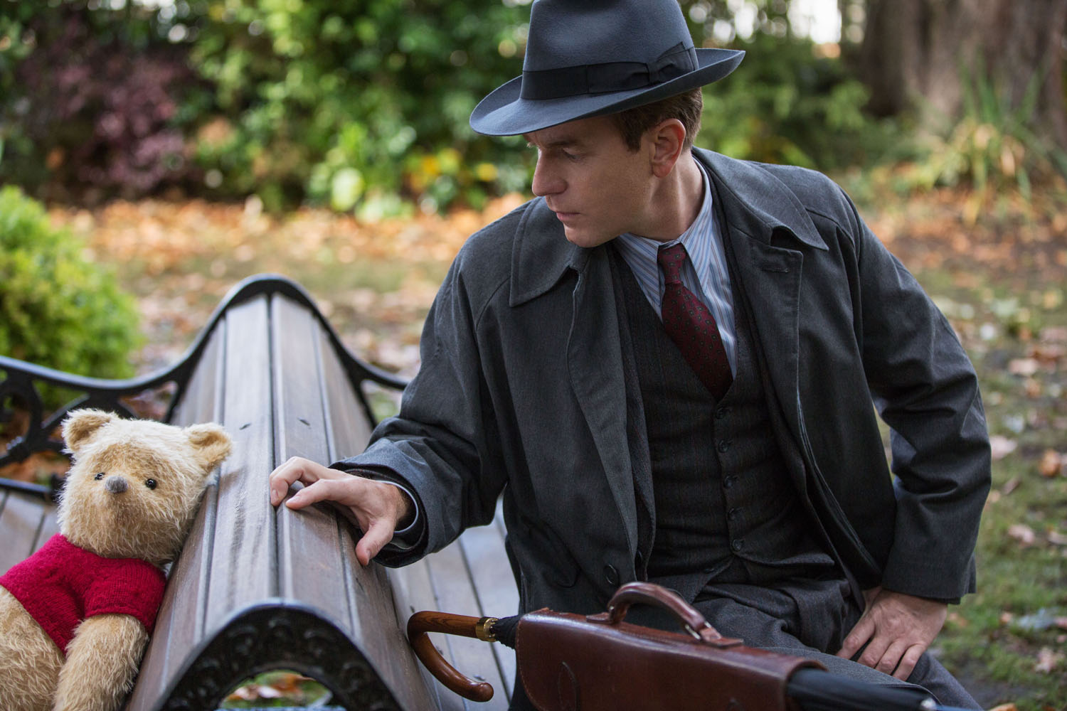 Christopher Robin (Ewan McGregor) with his longtime friend Winnie the Pooh in Disney’s CHRISTOPHER ROBIN.